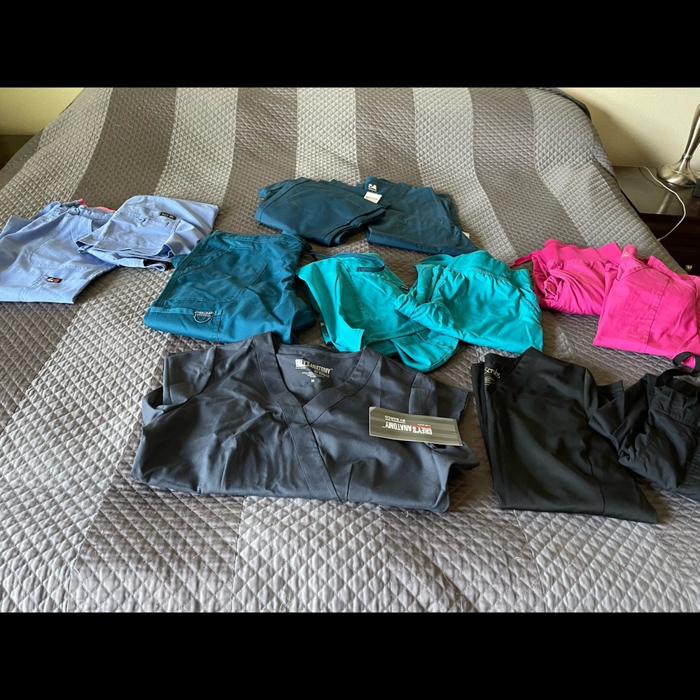 Lot of nursing scrubs…all like new,some of them with the tags on still.Grey’s A